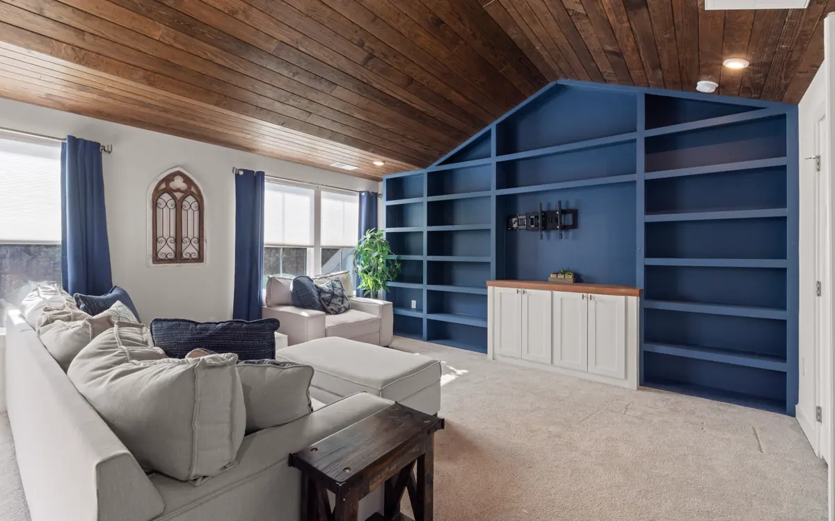 Living room with full-wall custom built-in shelving