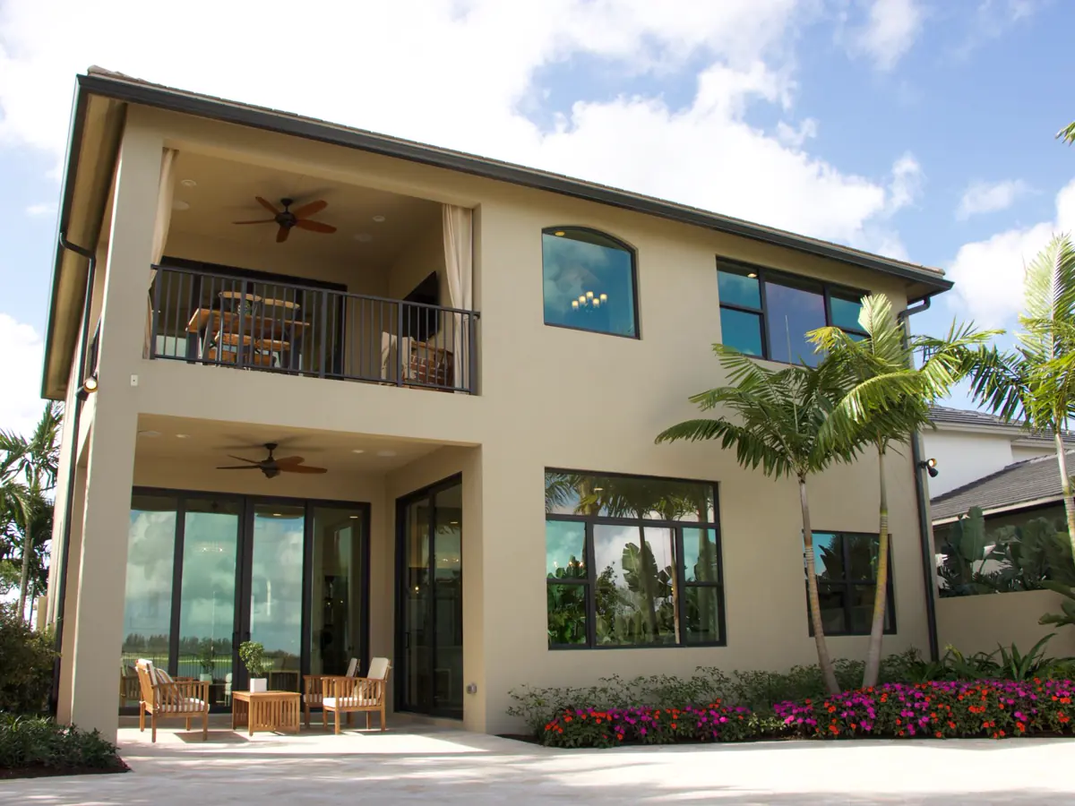 Modern Florida home exterior with landscaped outdoor living